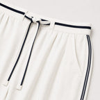 Women's white relaxed trousers detail view