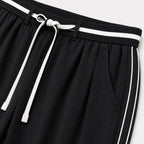 Women's black relaxed trousers detail view