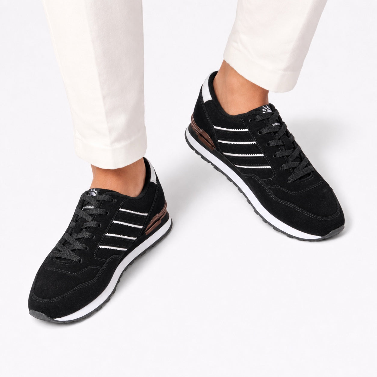 Black men's suede stripe trainers detail view