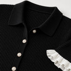 Black ribbed knit dress collar, buttons and ruffle detail