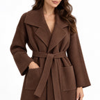 Women's ribbed knit belted longline coat detail