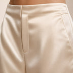 Apricot satin wide-leg trousers detail view