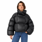 Women's glossy puffer jacket in Black - front view