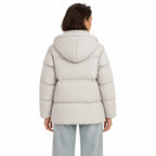 Women's hooded puffer jacket in Beige - back view