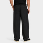 Black men's wide-leg pleated trousers back view