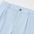 Men's light blue pinstripe pleated trousers waistband detail