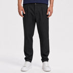Men's black pinstripe pleated trousers front view