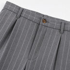 Men's grey pinstripe pleated trousers waistband detail